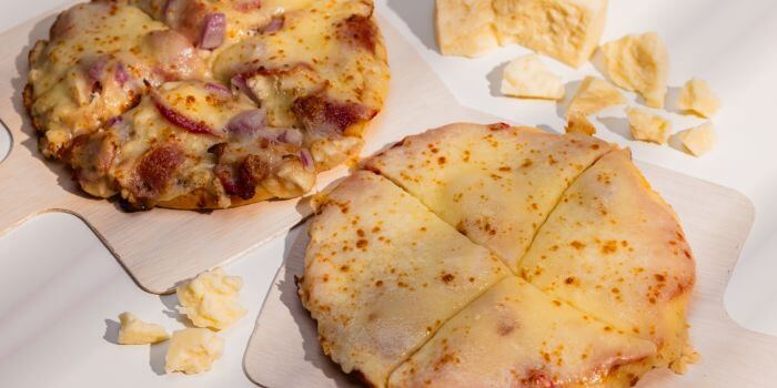 cheese pizza and sausage pizza